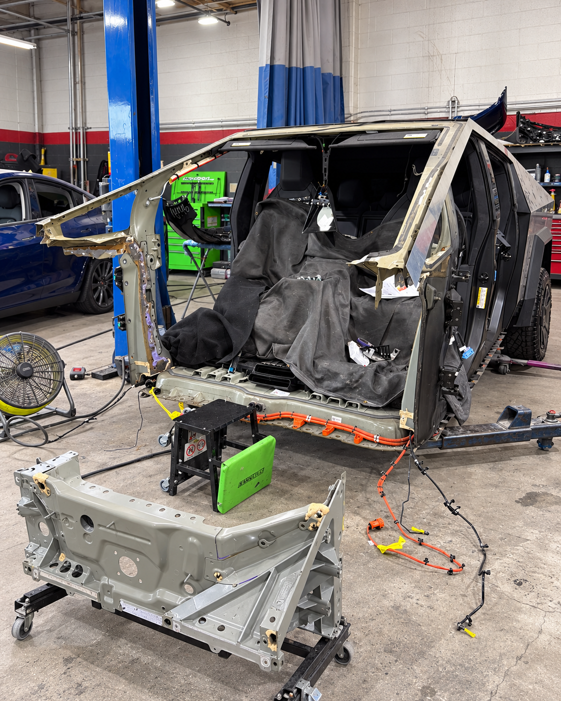 The same Tesla Cybertruck partly disassembled during structural repair
